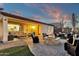 Inviting outdoor living space with a cozy fire pit and comfortable seating area at 16105 N 183Rd Dr, Surprise, AZ 85388