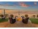 Enjoy outdoor gatherings with a central fire pit surrounded by comfortable seating at 16105 N 183Rd Dr, Surprise, AZ 85388