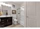 Well-lit bathroom featuring a glass enclosed shower and dark wood vanity with updated fixtures at 16105 N 183Rd Dr, Surprise, AZ 85388