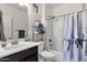 Functional bathroom with a combined tub and shower, a toilet, and a vanity with storage at 16105 N 183Rd Dr, Surprise, AZ 85388