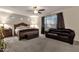 Comfortable bedroom with a large window, ceiling fan, and plush furnishings, creating a relaxing retreat at 16105 N 183Rd Dr, Surprise, AZ 85388