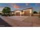 Charming single-story home with a well-manicured yard and a spacious three-car garage at 16105 N 183Rd Dr, Surprise, AZ 85388
