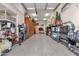 Spacious garage with epoxy flooring, built-in shelving, and ample storage space at 16105 N 183Rd Dr, Surprise, AZ 85388