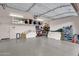 Spacious garage featuring epoxy floors and ample storage solutions for organized living at 16105 N 183Rd Dr, Surprise, AZ 85388