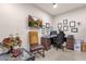 Home office displaying a desk, chair, and wall decor, creating an ideal workspace at 16105 N 183Rd Dr, Surprise, AZ 85388