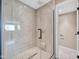 Modern bathroom features a large walk-in shower with a sleek glass enclosure and stylish tile work at 16805 S 29Th Pl, Phoenix, AZ 85048