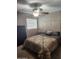 Bedroom featuring a bed, ceiling fan, and neutral color scheme at 16805 S 29Th Pl, Phoenix, AZ 85048
