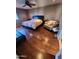 Bedroom with hard wood floors, ceiling fan and cozy chair at 16805 S 29Th Pl, Phoenix, AZ 85048