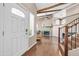 Open foyer showcasing wood floors, a staircase, high ceilings, and a glimpse of the living room at 16805 S 29Th Pl, Phoenix, AZ 85048