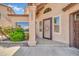 Close up of front entrance with decorative security door, manicured landscaping, and house number at 16805 S 29Th Pl, Phoenix, AZ 85048