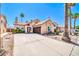 Charming single-story home with desert landscaping, long driveway, and an attached two-car garage at 16805 S 29Th Pl, Phoenix, AZ 85048