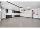Spacious three car garage, featuring ample cabinet storage and professionally coated flooring at 16805 S 29Th Pl, Phoenix, AZ 85048
