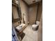 Stylish half bathroom with a unique sink bowl, vanity and stone mirror at 16805 S 29Th Pl, Phoenix, AZ 85048