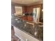This kitchen has granite counters, stainless appliances, and wood cabinets at 16805 S 29Th Pl, Phoenix, AZ 85048
