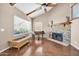Spacious living room featuring hardwood floors, a fireplace, and large windows for natural light at 16805 S 29Th Pl, Phoenix, AZ 85048