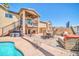 Inviting patio area featuring an outdoor dining set, lounge seating, and a private hot tub at 16805 S 29Th Pl, Phoenix, AZ 85048
