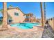 Sparkling pool with patio, mature palm trees, and desert landscaping at 16805 S 29Th Pl, Phoenix, AZ 85048