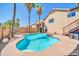 Sparkling private pool surrounded by lush palm trees and the home's exterior at 16805 S 29Th Pl, Phoenix, AZ 85048