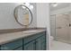 Stylish bathroom with decorative wallpaper, granite counters, and a tiled shower at 18206 N 45Th Ave, Glendale, AZ 85308