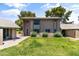 Inviting townhouse with green lawn, shrubs, and sidewalk under a partly cloudy sky at 18206 N 45Th Ave, Glendale, AZ 85308