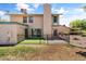 Rear exterior of home with fenced-in patio area overlooking a grassy green space at 18206 N 45Th Ave, Glendale, AZ 85308