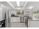Updated kitchen with stainless appliances, white cabinets, and granite countertops at 18206 N 45Th Ave, Glendale, AZ 85308