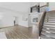 Bright living room with staircase, light walls, and wood-look flooring at 18206 N 45Th Ave, Glendale, AZ 85308
