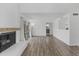 Spacious living room featuring a fireplace, wood floors, and sliding glass door at 18206 N 45Th Ave, Glendale, AZ 85308