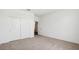 Clean bedroom with neutral carpeting and a closet with large sliding doors at 18809 E Bruno Dr, Gold Canyon, AZ 85118