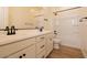 Well-lit bathroom featuring a double vanity, modern fixtures, and tile flooring at 1903 E Empeltre Rd, San Tan Valley, AZ 85140