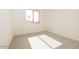 Bright bedroom with a large window and neutral carpet offers a peaceful retreat at 1903 E Empeltre Rd, San Tan Valley, AZ 85140