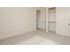 Bright bedroom with a large closet, neutral carpet, and easy access to additional rooms at 1903 E Empeltre Rd, San Tan Valley, AZ 85140