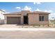 Charming single-story home with a two-car garage and desert landscaping at 1903 E Empeltre Rd, San Tan Valley, AZ 85140