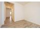 Hallway featuring wood-look tile flooring, neutral walls, and leads to additional rooms at 1903 E Empeltre Rd, San Tan Valley, AZ 85140
