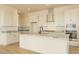 Modern kitchen featuring white cabinetry, stainless steel appliances, and granite countertops at 1903 E Empeltre Rd, San Tan Valley, AZ 85140