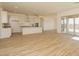 Open concept living room with wood floors, recessed lighting, and natural light at 1903 E Empeltre Rd, San Tan Valley, AZ 85140