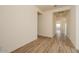 Spacious living room with wood-look tile flooring, neutral walls, and ample natural light at 1903 E Empeltre Rd, San Tan Valley, AZ 85140