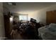 Cluttered bedroom featuring a window, an air conditioner, and stacks of boxes, offering spacious potential for renovation at 2030 N 21St Pl, Phoenix, AZ 85006