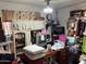 A messy bedroom featuring a fan, a television and disorganized belongings at 2030 N 21St Pl, Phoenix, AZ 85006