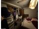 View of a disorganized bedroom with clothes and personal items at 2030 N 21St Pl, Phoenix, AZ 85006