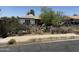 A single-story home features a yard filled with cacti and vegetation behind a wrought iron fence at 2030 N 21St Pl, Phoenix, AZ 85006