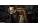 A dim and cluttered kitchen featuring dated appliances, presenting a prime opportunity for a modern renovation at 2030 N 21St Pl, Phoenix, AZ 85006