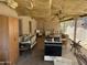 A covered patio is disorganized, holding both furniture and an old range at 2030 N 21St Pl, Phoenix, AZ 85006