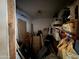 A cluttered storage room filled with boxes and furniture, offering an opportunity for decluttering and organization at 2030 N 21St Pl, Phoenix, AZ 85006