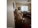 Bedroom featuring desk, chair, curtains, and storage at 2102 W Hazelwood St, Phoenix, AZ 85015