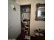 Bedroom closet with door ajar featuring clothes, shelving, and storage space at 2102 W Hazelwood St, Phoenix, AZ 85015