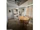 A cozy dining area with an oval table and vintage cabinet, bathed in natural light at 2102 W Hazelwood St, Phoenix, AZ 85015