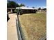 Modest single story home featuring a front yard with minimal landscaping enclosed by a chain link fence at 2102 W Hazelwood St, Phoenix, AZ 85015