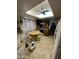 Bright kitchen featuring a skylight, ceiling fan, round table, and ample cabinet space at 2102 W Hazelwood St, Phoenix, AZ 85015