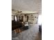 Spacious living room with carpet, featuring a ceiling fan and comfortable seating at 2102 W Hazelwood St, Phoenix, AZ 85015